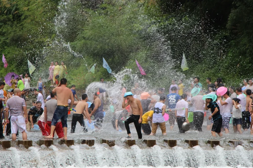 A crowd is splashing water with each other during the Songkran Festival in Thailand